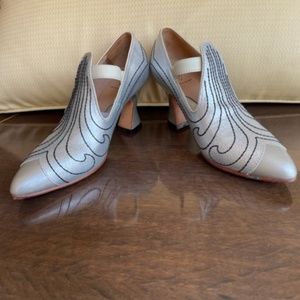 John Fluevog womens silver heels in size 5.